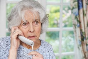 Scared Looking Senior Woman Talking on the Phone