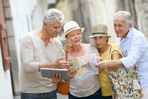 Two Senior Couples Looking at a Map