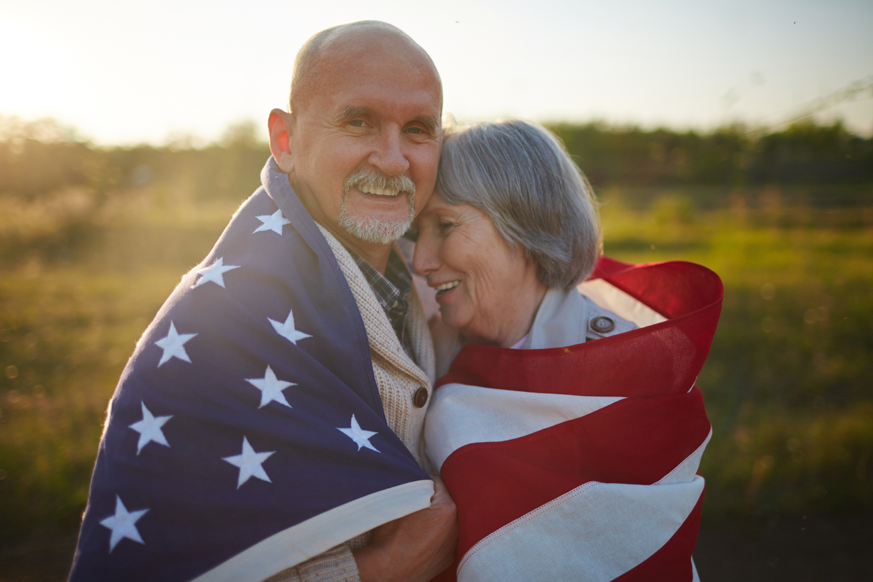 Older adults under an American flag